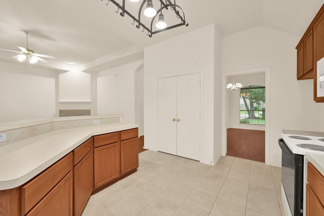 3722 Lovers Ln, Montgomery, TX 77356 - kitchen featuring range with electric cooktop, brown cabinetry, a chandelier, ceiling fan, and lofted ceiling