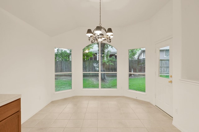 3722 Lovers Ln, Montgomery, TX 77356 - unfurnished dining area with a chandelier, light tile patterned floors, and lofted ceiling