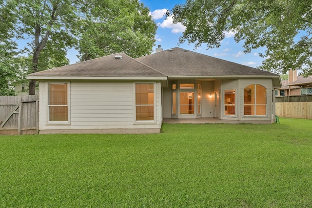 3722 Lovers Ln, Montgomery, TX 77356 - rear view of house featuring a shingled roof, a patio area, and a chimney