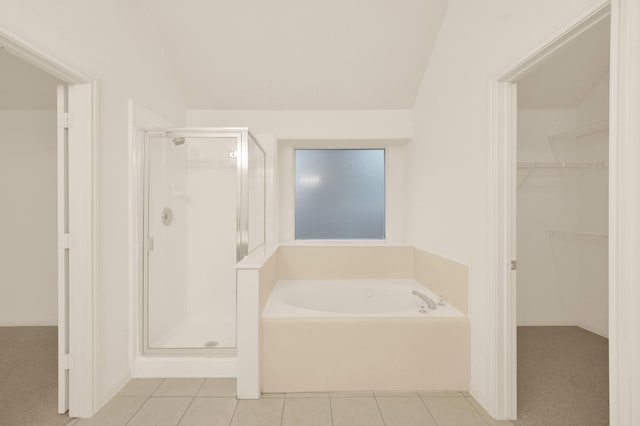 3722 Lovers Ln, Montgomery, TX 77356 - bathroom with a stall shower, a garden tub, tile patterned flooring, a spacious closet, and lofted ceiling