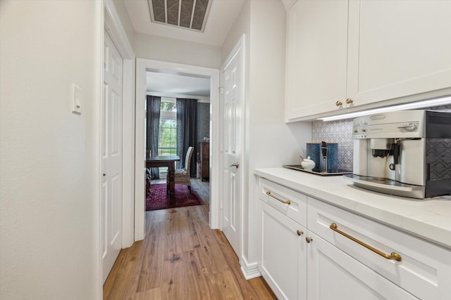 15411 Parkwood Way, Houston, TX 77059 - hallway with light wood-type flooring