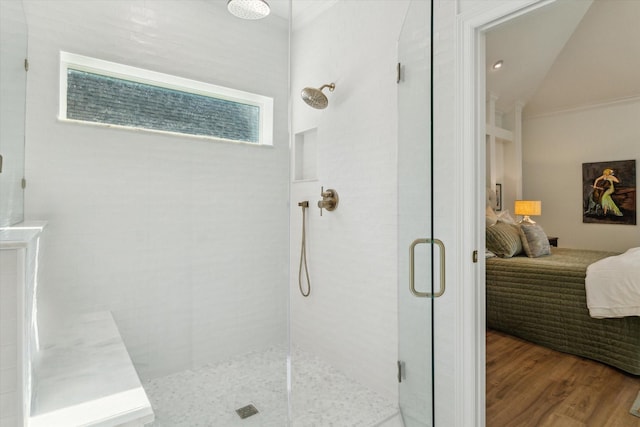 15411 Parkwood Way, Houston, TX 77059 - bathroom with connected bathroom, a shower stall, wood finished floors, and vaulted ceiling
