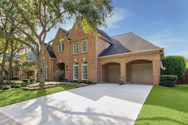 15411 Parkwood Way, Houston, TX 77059 - view of front of house with brick siding, a garage, a front lawn, driveway, and roof with shingles