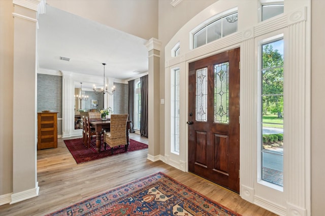 15411 Parkwood Way, Houston, TX 77059 - entryway with a chandelier, wood finished floors, ornamental molding, and baseboards
