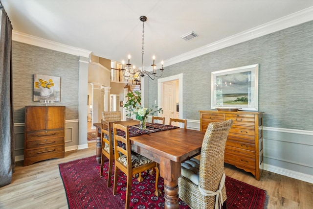 15411 Parkwood Way, Houston, TX 77059 - dining space featuring a chandelier, ornamental molding, light wood-style floors, wallpapered walls, and wainscoting