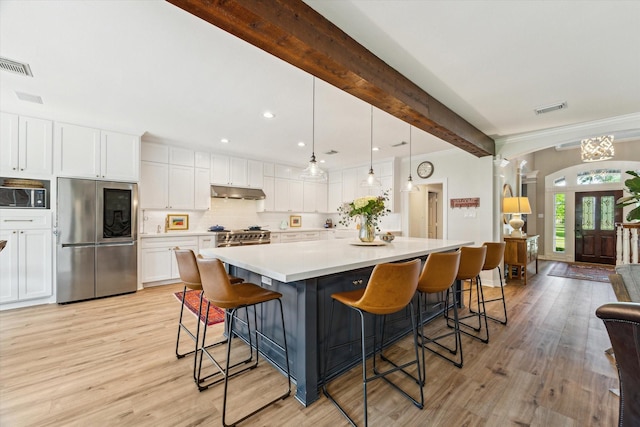 15411 Parkwood Way, Houston, TX 77059 - kitchen with smart refrigerator, under cabinet range hood, white cabinets, light wood-type flooring, and beamed ceiling