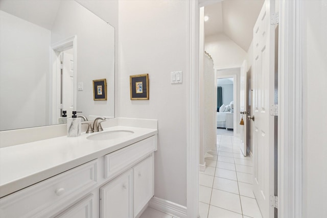 15411 Parkwood Way, Houston, TX 77059 - bathroom with tile patterned floors, vaulted ceiling, vanity, and baseboards