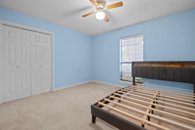 608 Craig Dr, Palestine, TX 75803 - unfurnished bedroom with carpet flooring, a closet, baseboards, and a ceiling fan