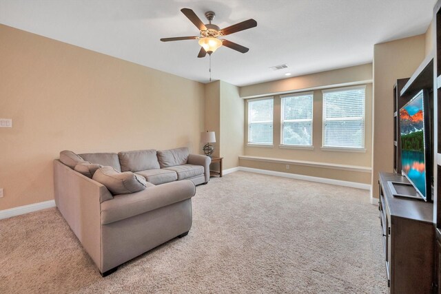 510 Pearl View Ln, Pinehurst, TX 77362 - living area featuring carpet flooring, ceiling fan, and baseboards