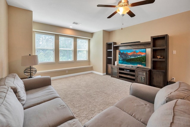 510 Pearl View Ln, Pinehurst, TX 77362 - carpeted living area with a ceiling fan and baseboards