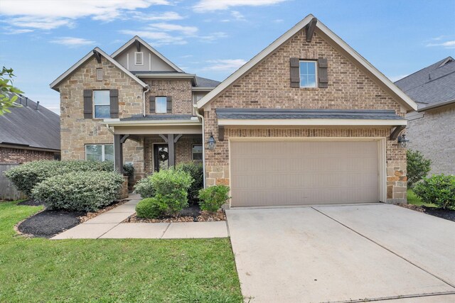 510 Pearl View Ln, Pinehurst, TX 77362 - craftsman-style house featuring driveway, stone siding, and brick siding