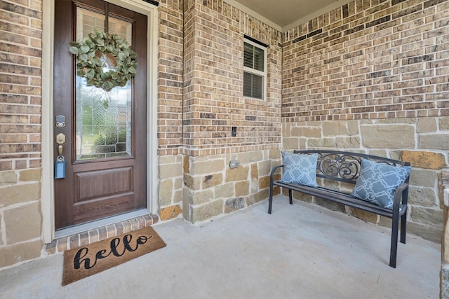 510 Pearl View Ln, Pinehurst, TX 77362 - doorway to property featuring a porch and brick siding