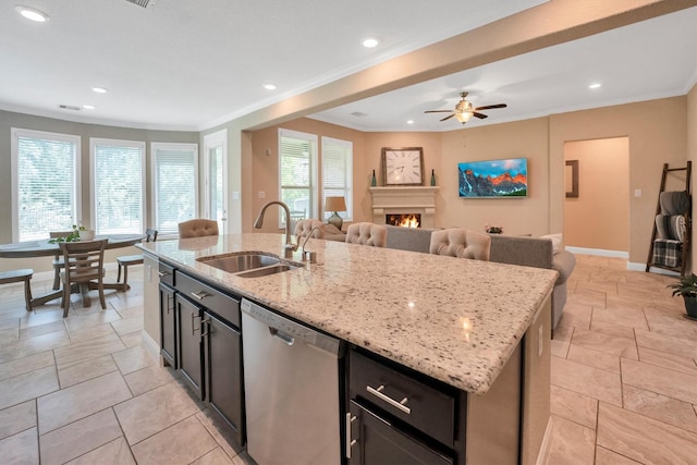 510 Pearl View Ln, Pinehurst, TX 77362 - kitchen with dishwasher, a sink, open floor plan, a warm lit fireplace, and ornamental molding