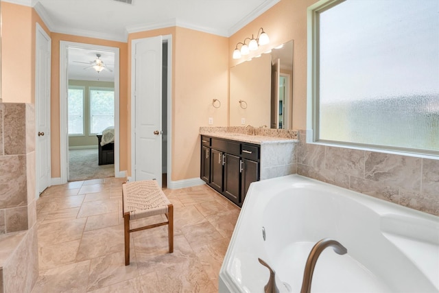 510 Pearl View Ln, Pinehurst, TX 77362 - ensuite bathroom with ornamental molding, a garden tub, vanity, baseboards, and a ceiling fan
