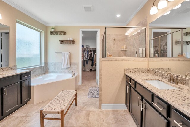 510 Pearl View Ln, Pinehurst, TX 77362 - full bath featuring a stall shower, ornamental molding, vanity, a garden tub, and a walk in closet