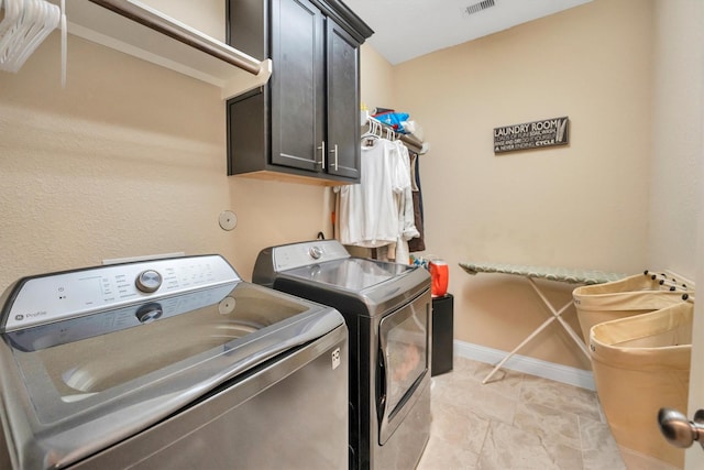 510 Pearl View Ln, Pinehurst, TX 77362 - laundry room with cabinet space, washing machine and clothes dryer, and baseboards