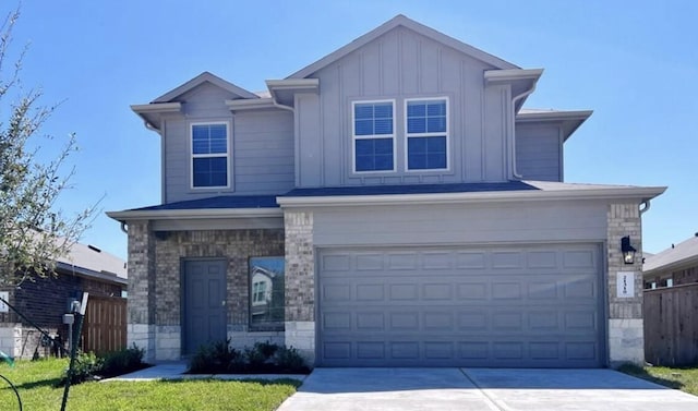 21310 Black Leaf Dr, New Caney, TX 77357 - craftsman inspired home with concrete driveway, board and batten siding, an attached garage, and stone siding