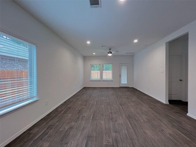 21310 Black Leaf Dr, New Caney, TX 77357 - unfurnished living room with dark wood-style flooring, a ceiling fan, baseboards, and recessed lighting