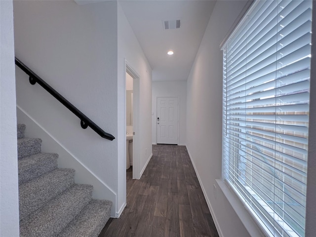 21310 Black Leaf Dr, New Caney, TX 77357 - hall featuring dark wood-style flooring, baseboards, recessed lighting, and stairs