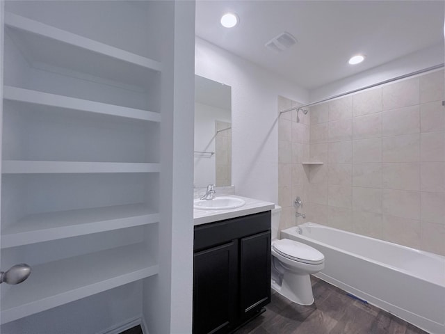 21310 Black Leaf Dr, New Caney, TX 77357 - bathroom with toilet, vanity, wood finished floors,  shower combination, and recessed lighting