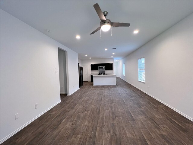 21310 Black Leaf Dr, New Caney, TX 77357 - unfurnished living room with a ceiling fan, baseboards, dark wood-type flooring, and recessed lighting