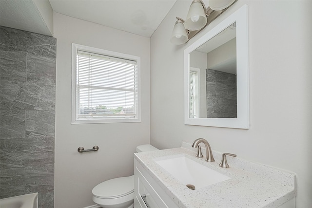 bathroom featuring toilet and vanity