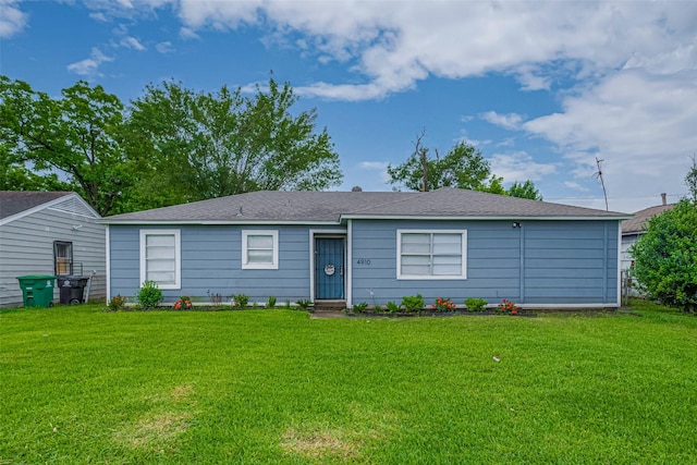 single story home with a front lawn and roof with shingles