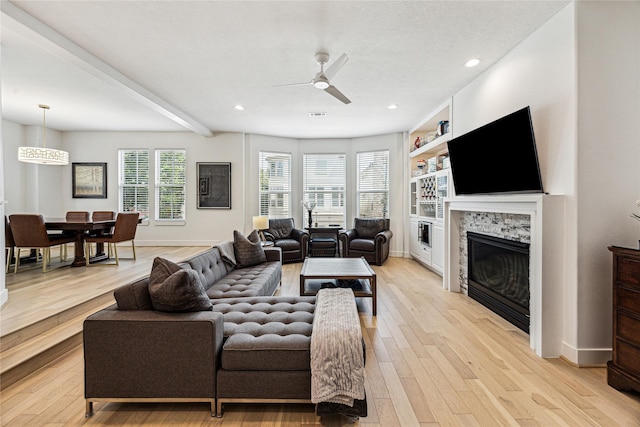822 Reinicke St, Houston, TX 77007 - living area with ceiling fan, a glass covered fireplace, light wood-style floors, recessed lighting, and baseboards