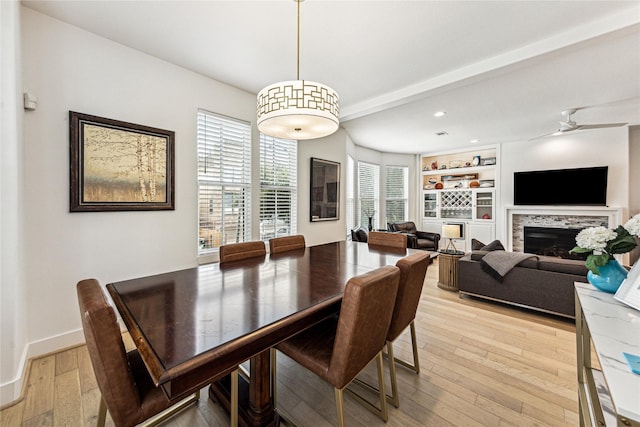 822 Reinicke St, Houston, TX 77007 - dining room with light wood-style floors, a ceiling fan, recessed lighting, built in features, and baseboards
