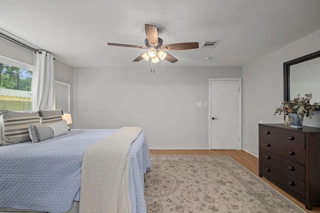 13 Leverwood Ct, The Woodlands, TX 77381 - bedroom featuring wood finished floors and ceiling fan