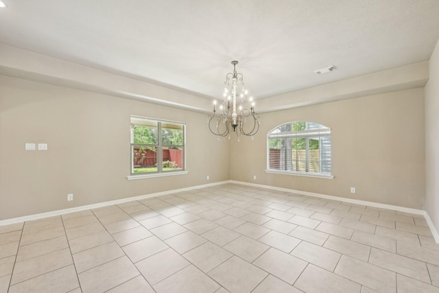 12885 Andromeda Ct, Willis, TX 77318 - unfurnished room with a chandelier, light tile patterned flooring, and baseboards