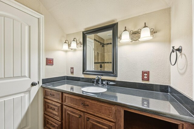 12885 Andromeda Ct, Willis, TX 77318 - full bathroom featuring a textured wall and vanity