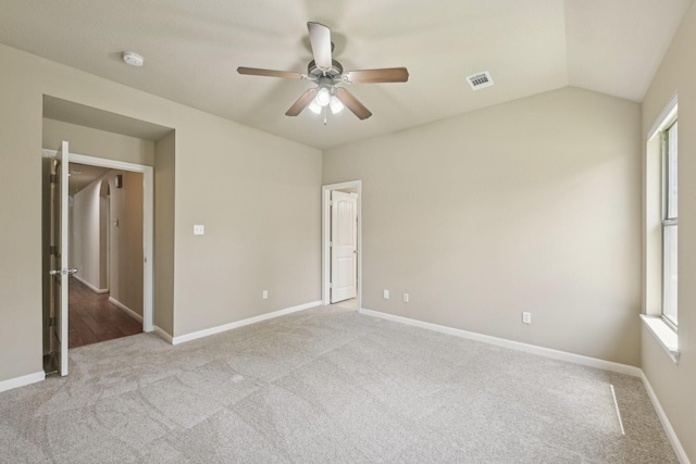 12885 Andromeda Ct, Willis, TX 77318 - unfurnished bedroom with carpet flooring, baseboards, lofted ceiling, and a ceiling fan