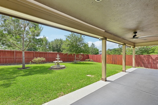 12885 Andromeda Ct, Willis, TX 77318 - view of yard featuring a patio area and a ceiling fan