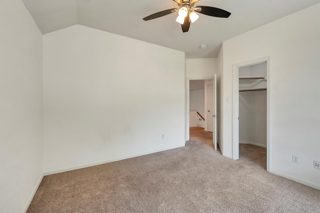 12139 Canyon Arbor Way, Houston, TX 77095 - unfurnished bedroom featuring light carpet, lofted ceiling, a spacious closet, baseboards, and a closet