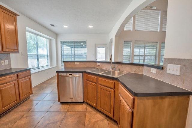 12139 Canyon Arbor Way, Houston, TX 77095 - kitchen featuring a sink, dishwasher, dark countertops, backsplash, and light tile patterned flooring