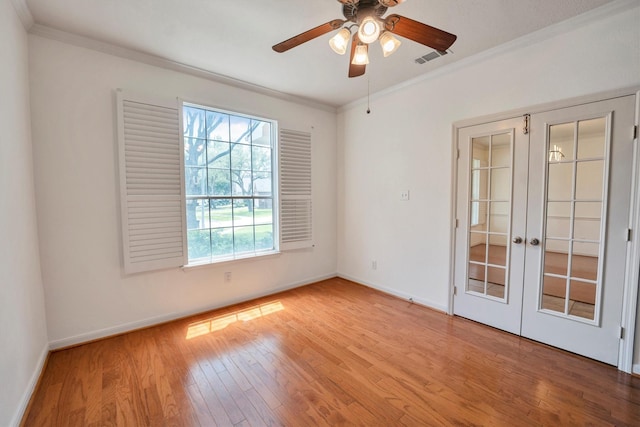 12139 Canyon Arbor Way, Houston, TX 77095 - spare room featuring french doors, crown molding, wood finished floors, baseboards, and a ceiling fan