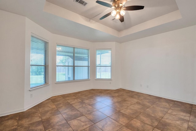 12139 Canyon Arbor Way, Houston, TX 77095 - empty room featuring a raised ceiling, a ceiling fan, baseboards, and tile patterned floors