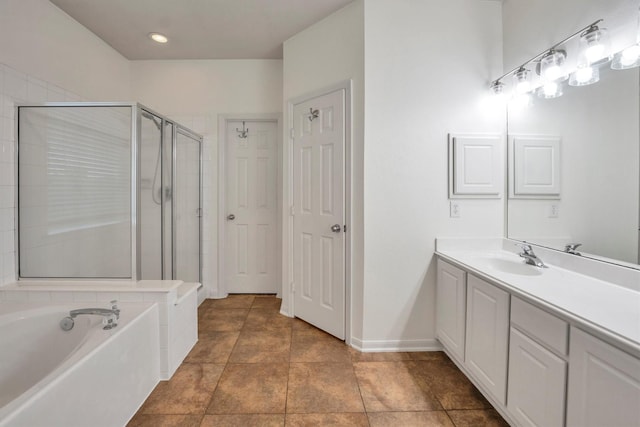 12139 Canyon Arbor Way, Houston, TX 77095 - full bathroom with a shower stall, a garden tub, vanity, baseboards, and tile patterned flooring