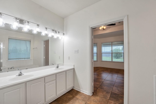 12139 Canyon Arbor Way, Houston, TX 77095 - full bathroom featuring tile patterned floors, a garden tub, double vanity, and baseboards