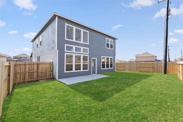 404 Kendall Crest Dr, Alvin, TX 77511 - rear view of house with a patio area