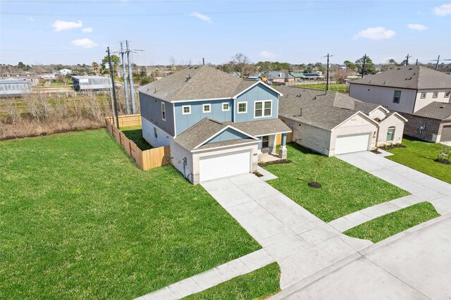 404 Kendall Crest Dr, Alvin, TX 77511 - traditional home featuring driveway, roof with shingles, a residential view, and a garage