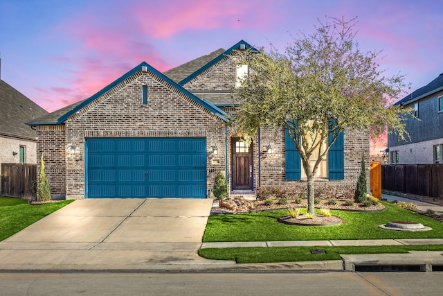 7114 Clubtail Rd, Katy, TX 77493 - view of front of property featuring a garage, brick siding, driveway, and a shingled roof