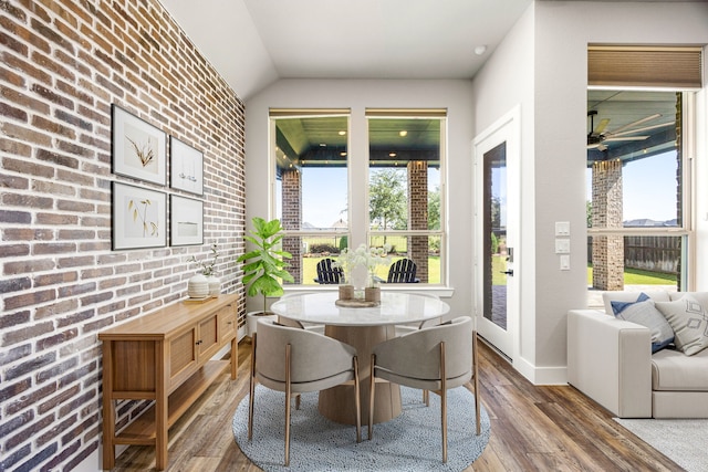 7114 Clubtail Rd, Katy, TX 77493 - dining room with healthy amount of natural light, wood finished floors, lofted ceiling, ceiling fan, and baseboards