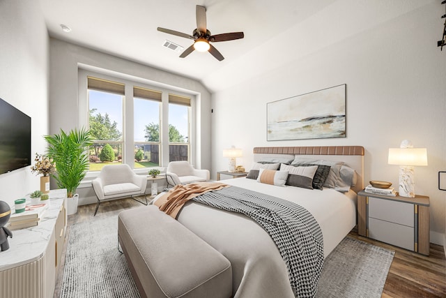 7114 Clubtail Rd, Katy, TX 77493 - bedroom with wood finished floors, lofted ceiling, and a ceiling fan
