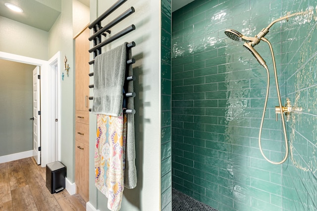 7114 Clubtail Rd, Katy, TX 77493 - bathroom featuring wood finished floors, walk in shower, and baseboards