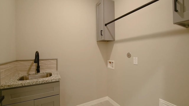 2716 Garapan St, Houston, TX 77091 - laundry room featuring cabinet space, washer hookup, and baseboards