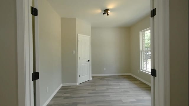 2716 Garapan St, Houston, TX 77091 - spare room featuring light wood-style flooring and baseboards