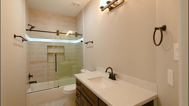 2716 Garapan St, Houston, TX 77091 - bathroom with toilet, vanity, and combined bath / shower with glass door