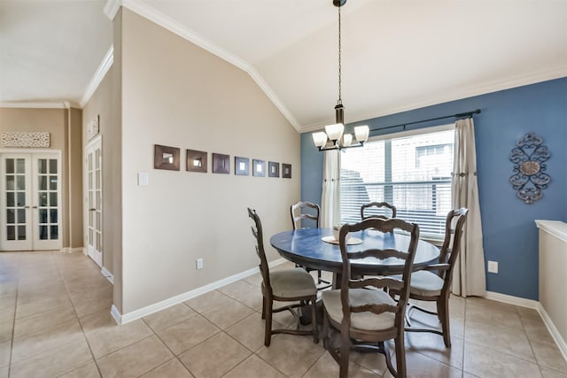 dining room with light tile patterned flooring, crown molding, a chandelier, baseboards, and lofted ceiling